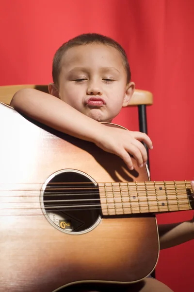 Little music student playing the guitar — Stock Photo, Image