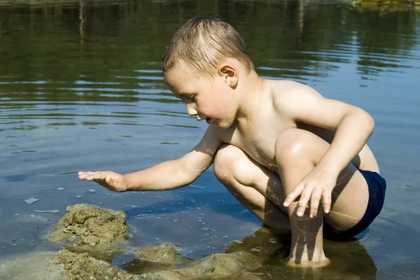 Boy in river — Stock Photo, Image