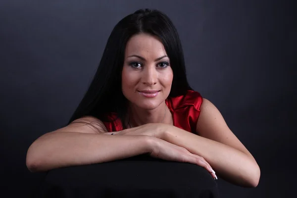 Young woman in red dress — Stock Photo, Image