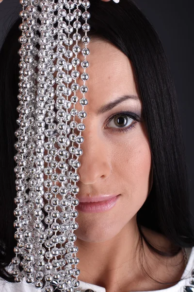 Girl isolated on grey with bead — Stock Photo, Image