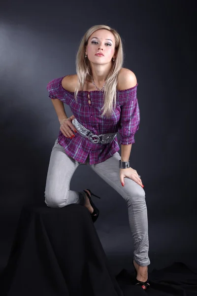 Girl posing in studio over black background — Stock Photo, Image