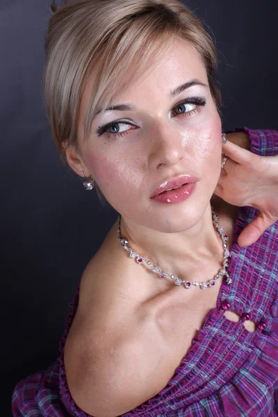 Girl posing in studio over black background — Stock Photo, Image