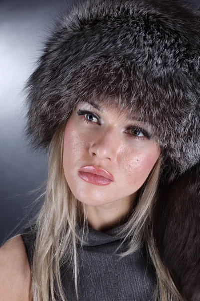 Lovely young woman in winter fur hat — Stock Photo, Image