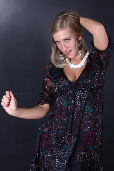 Portrait of the beautiful blonde on a black background — Stock Photo, Image