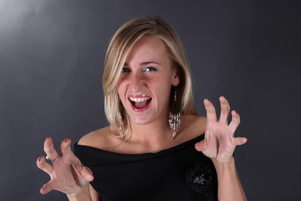 Portrait of the beautiful blonde on a black background — Stock Photo, Image