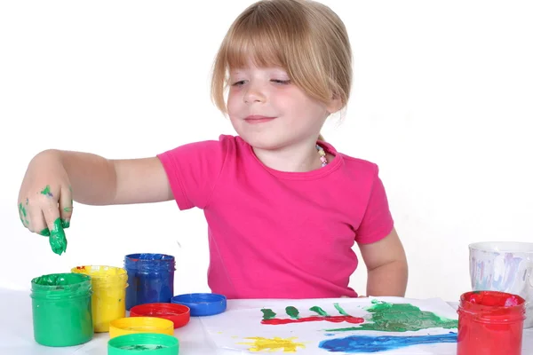 Menina com tinta isolada no branco — Fotografia de Stock