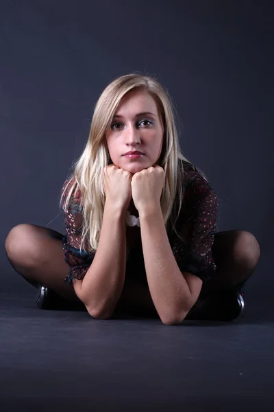 Portrait of the beautiful blonde on a black background — Stock Photo, Image