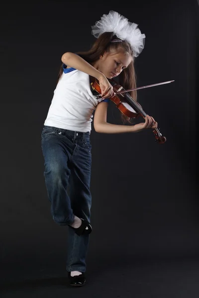 Child playing violin on isolated black background — Stock Photo, Image