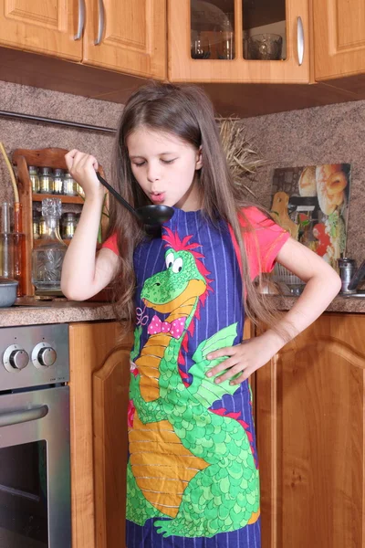 Little girl cooking in the kitchen — Stock Photo, Image