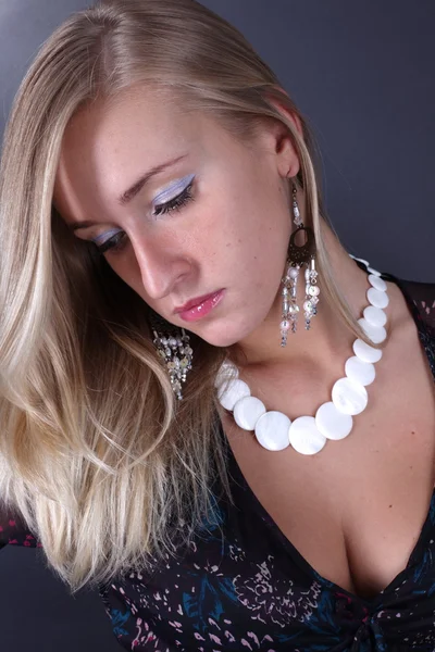 Portrait of the beautiful blonde on a black background — Stock Photo, Image