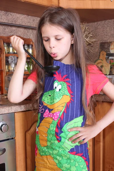 Little girl cooking in the kitchen — Stock Photo, Image