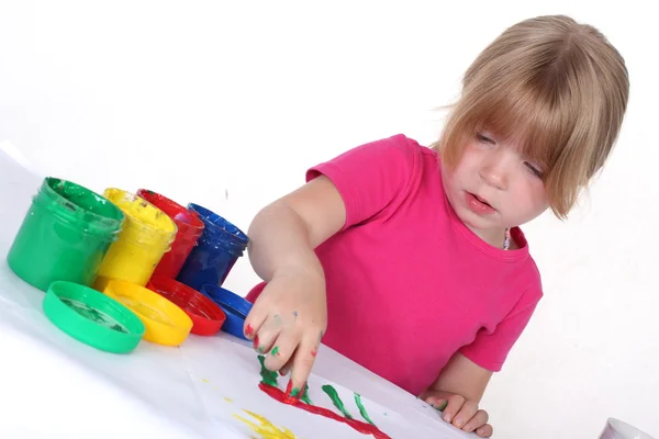 Menina com tinta isolada no branco — Fotografia de Stock