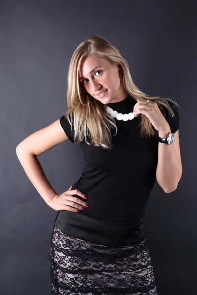 Young beautiful women posing in black t-shirt. Royalty Free Stock Images