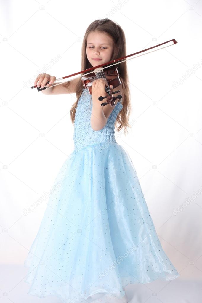 Child playing violin on isolated white background