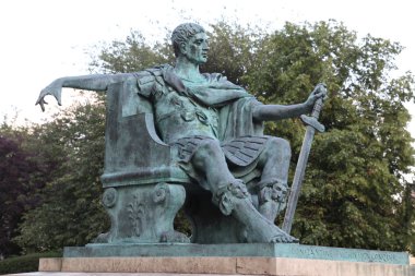 A bronze statue of Constantine I outside York Minster in England clipart