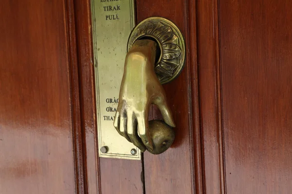 Door handle in shape of human hand, Barcelona — Stock Photo, Image