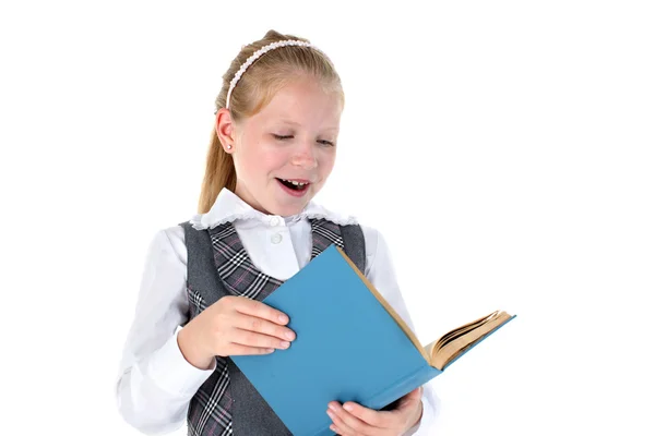 8 year old school girl with book smiling on white background — Stockfoto