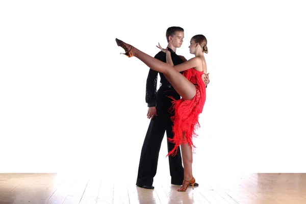 Latino dancers in ballroom against white background — Stock Photo, Image