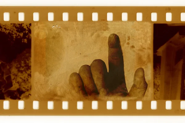 Человеческая рука в фотографическом кино — стоковое фото