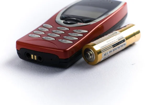 Telefoon en batterij — Stockfoto