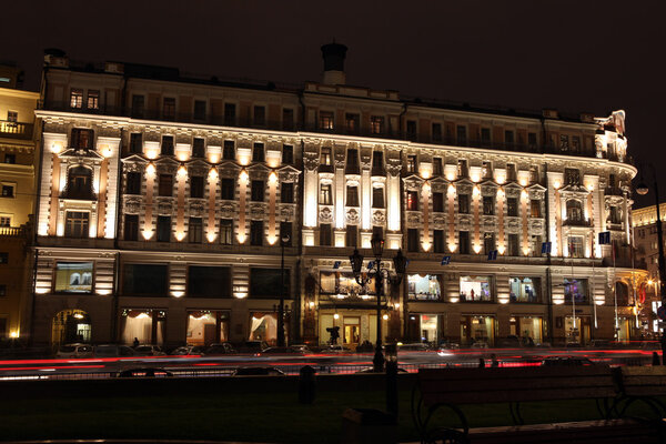Night View of history Hotel National through night traffic in Mohovaya street, Moscow, Russia
