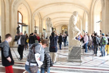 PARIS - MAY 3: Visitors at the Louvre Museum, May 3, 2013 in Par clipart