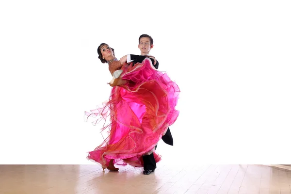 Latino dancers in ballroom against white background — Stock Photo, Image