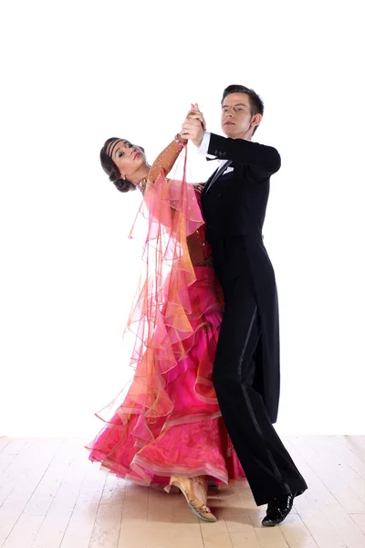 Latino dancers in ballroom against white background — Stock Photo, Image