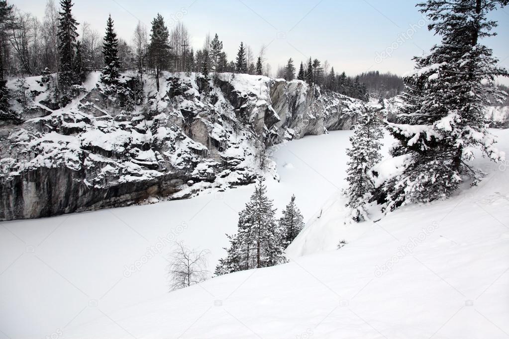 Winter snowfall in old marble quarry, Karelia, Russia