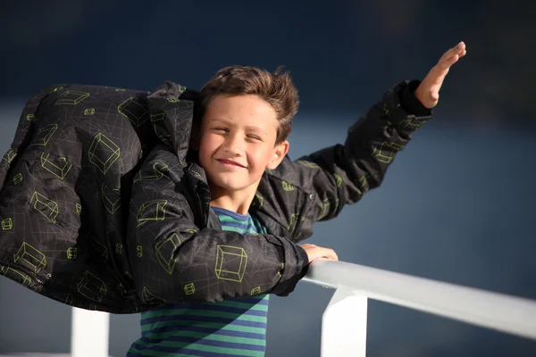 Boy catching wind — Stock Photo, Image