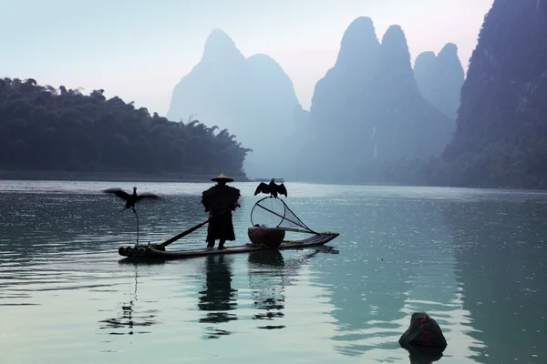 Homem chinês pesca — Fotografia de Stock