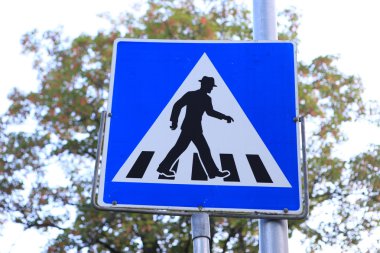 funny pedestrian crossing sign in hat clipart