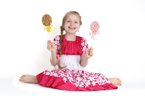 Schattig klein meisje 8 jaar oude met snoep zoete — Stockfoto