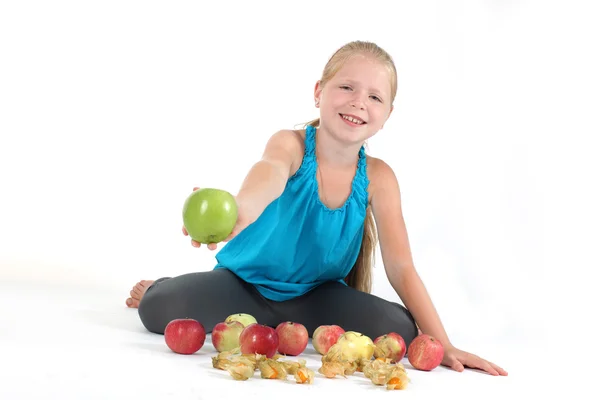 Adorable little girl with apple — Stock Photo, Image