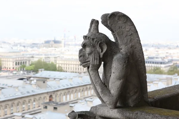 Stone gargoyle on top of Notre Dame Cathedral — Stock Photo, Image