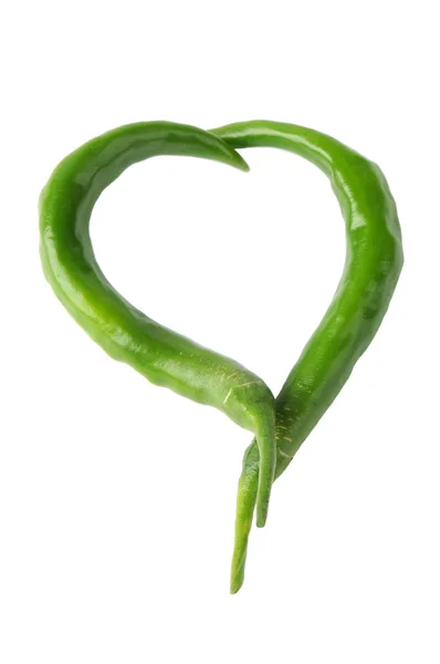 Two green peppers in a heart shape — Stock Photo, Image