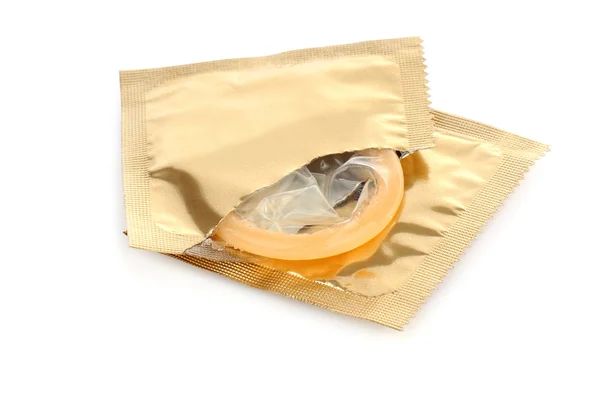Yellow condom with open pack on white background — Stock Photo, Image