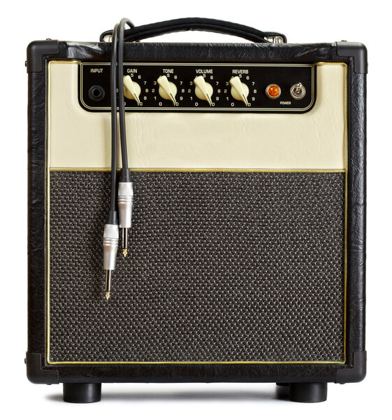 Black vintage guitar aplifier with cable, isolated on white