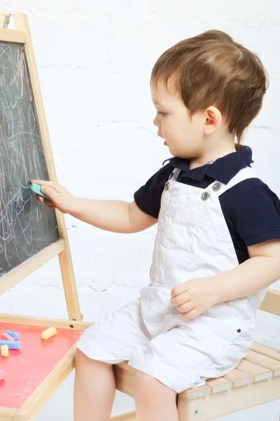 Child Drawing With Chalk Royalty Free Stock Images