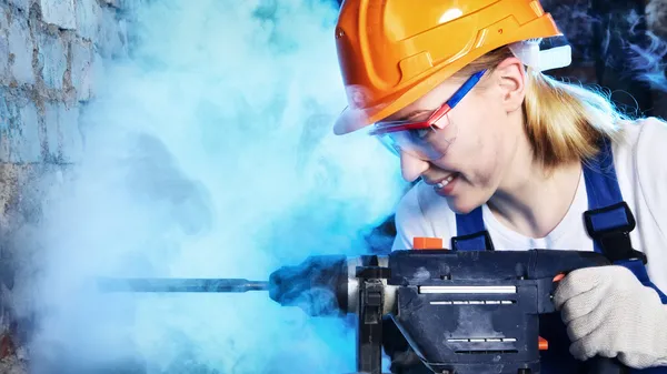 Beautiful Woman Drill the Wall — Stock Photo, Image