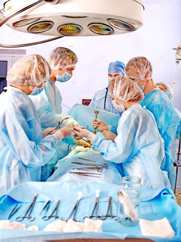 Surgeon at work in operating room.