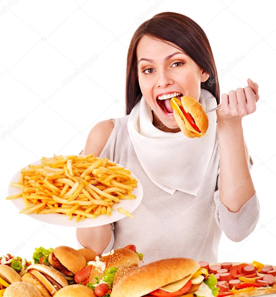 Woman eating fast food. Stock Photo by ©poznyakov 12071495