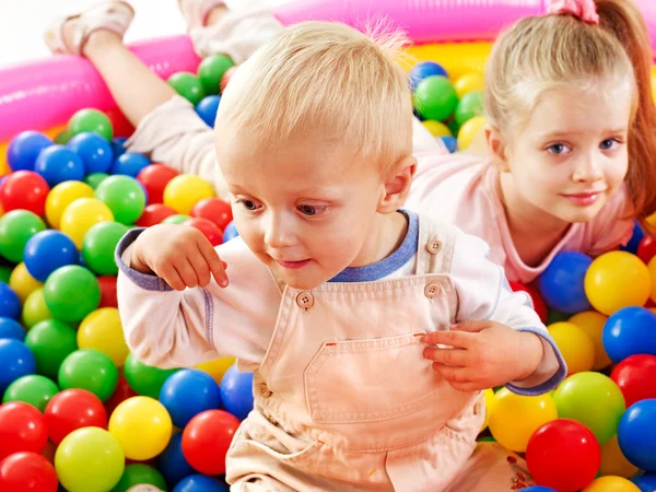 Child in colored ball. Stock Picture