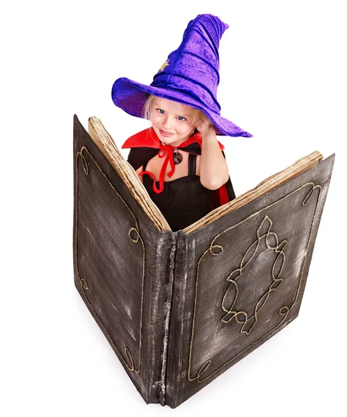 Witch little girl holding book. — Stock Photo, Image