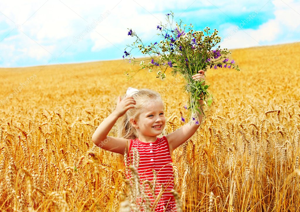 Child in wheat field.