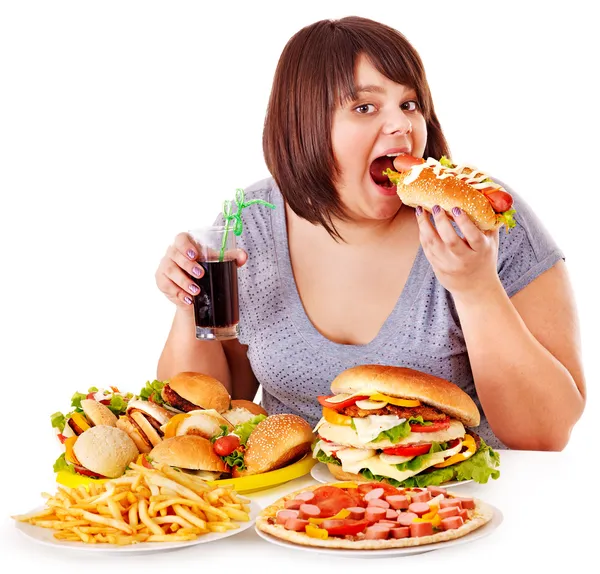 Mujer comiendo comida rápida. — Foto de Stock