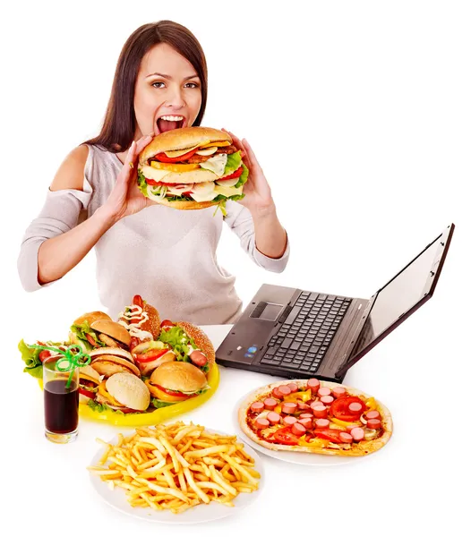 Woman eating junk food. — Stockfoto