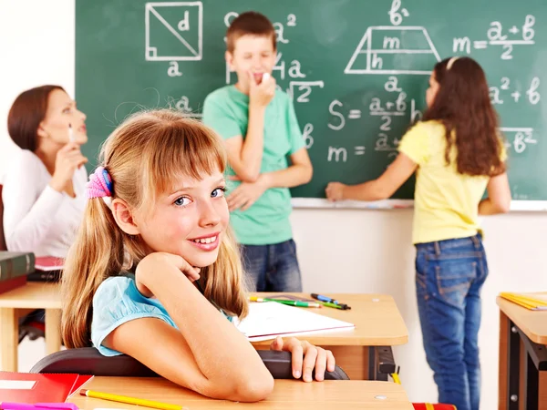 Criança escolar com professor . — Fotografia de Stock