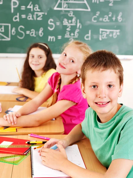 School child sitting in classroom. Royalty Free Stock Images