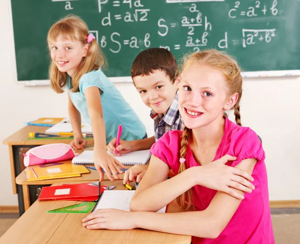 School child sitting in classroom. Royalty Free Stock Photos